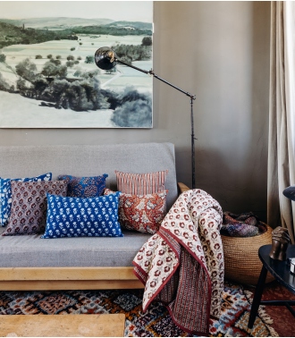 Boho chic home decor with indian quilt and printed cushion covers