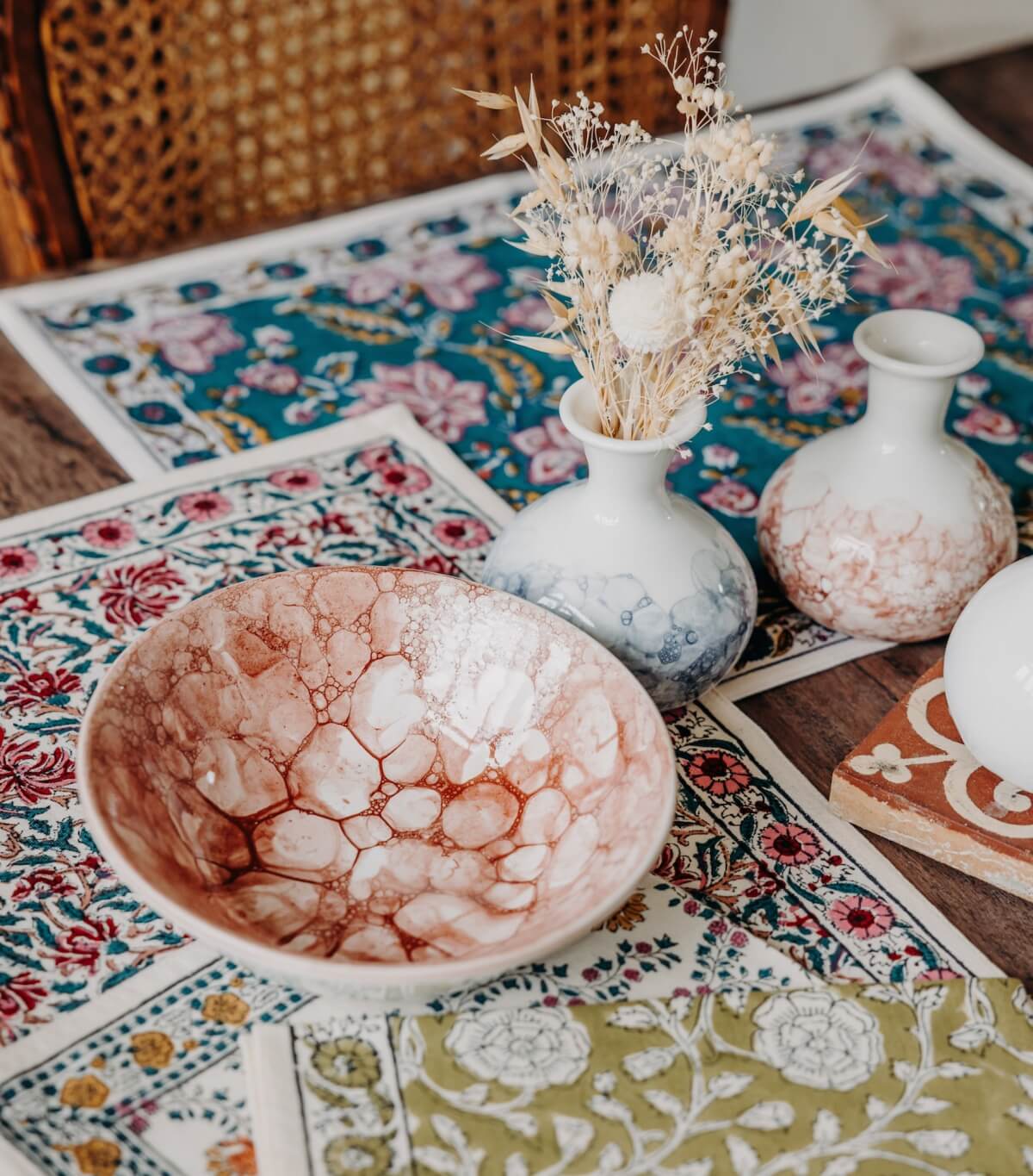 Table linen by Jamini and Red ceramic bowl
