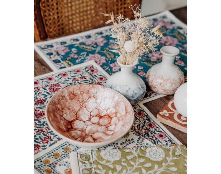 Table linen by Jamini and Red ceramic bowl