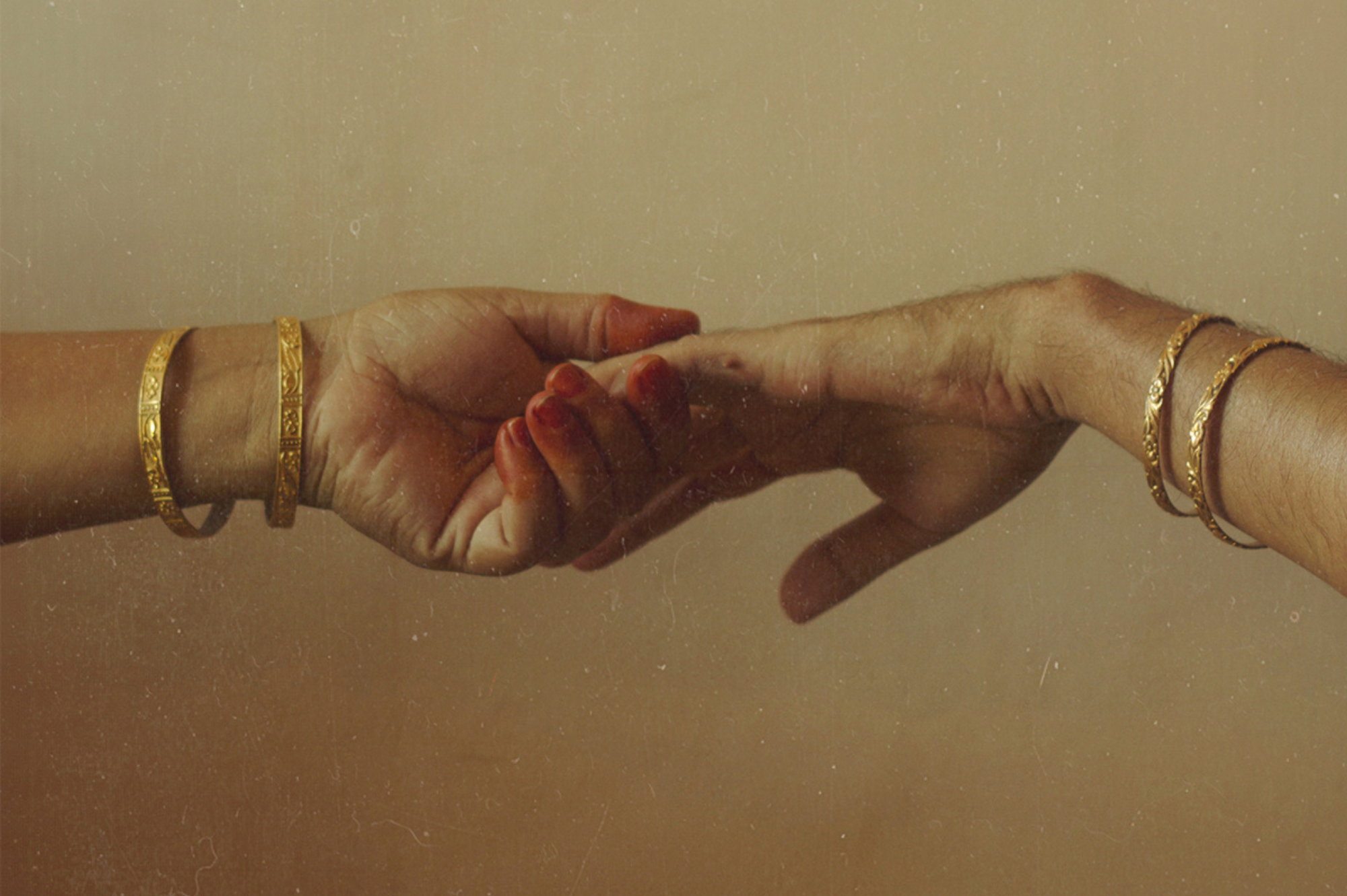 two hands holding each other