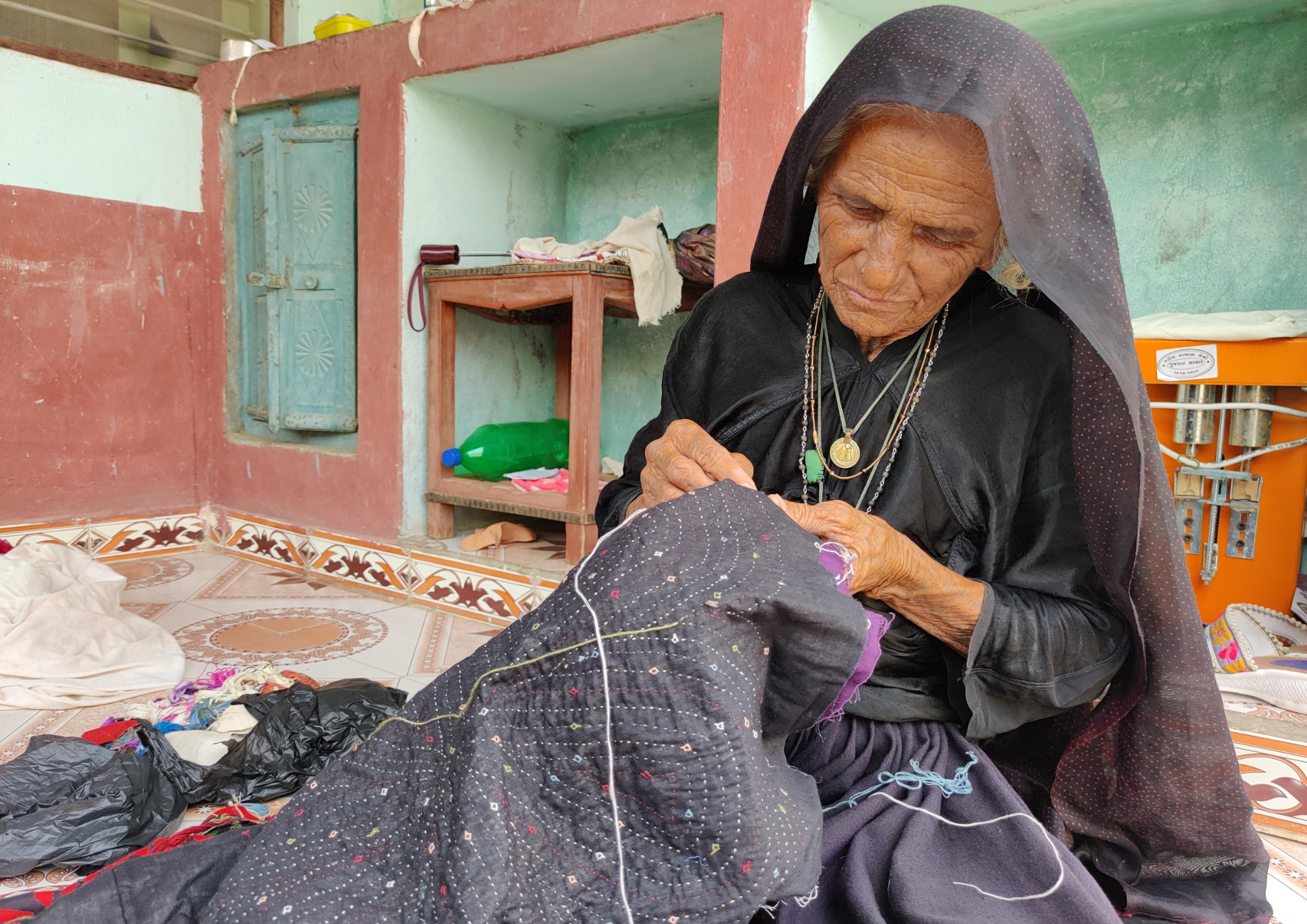 Embroiderer woman of India