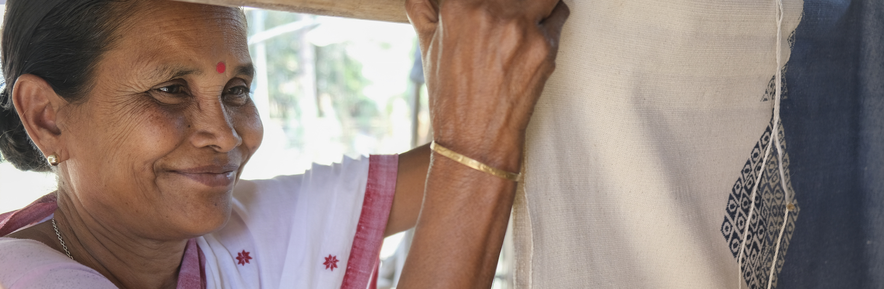 Indian woman weaving in Assam